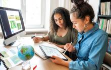 Two young women working on climate change project