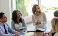 a group of educators meeting together at a conference table