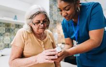 Health care worker with older patient