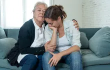 two women grieving together