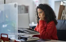 Woman looking serious at computer