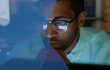 Man looking serious at a computer
