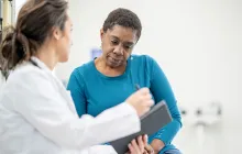 older female patient talking with her doctor