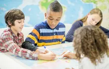 Students working together with a map