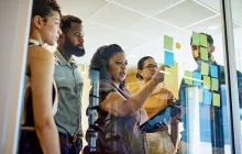 Business colleagues at a glass board