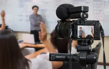 Video camera filming a teacher