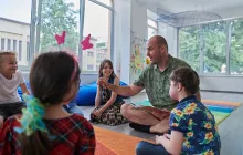 Preschool teacher with young students