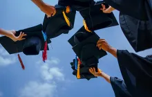 Graduation caps in the air