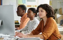 Young adults at a computer bank