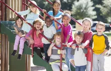 Group of diverse elementary students on playground