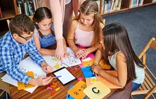 Elementary students working with math flash cards