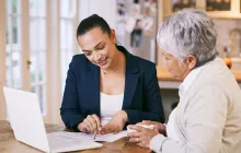 Older woman working with home health care professional