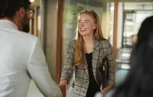 Woman shaking hand with colleague