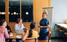 Teachers meeting in conference room