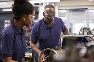 Apprentice with machinery