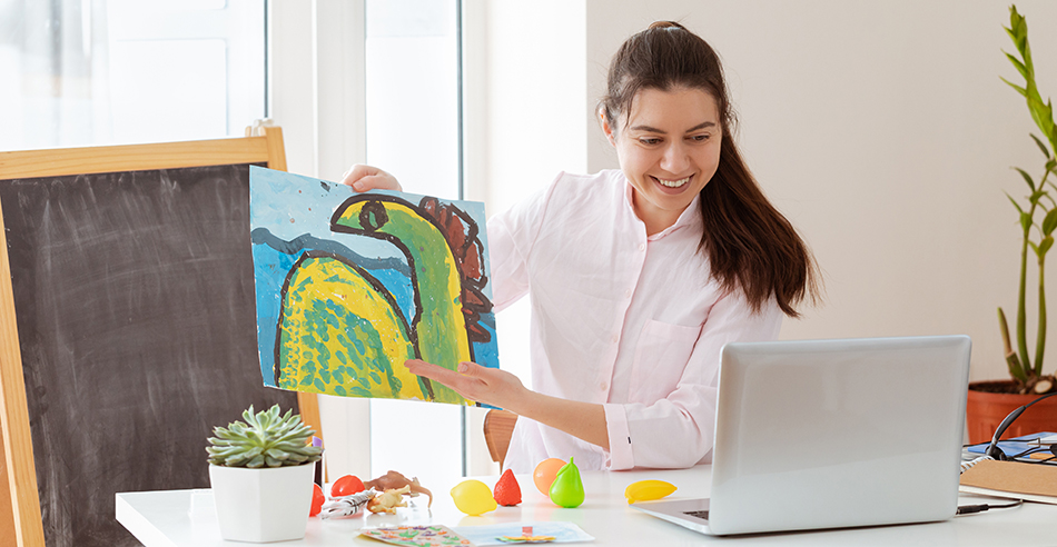 Image of teacher showing art to an online audience