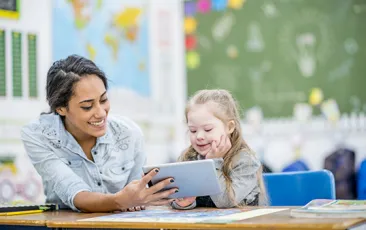teacher and student looking at ipad