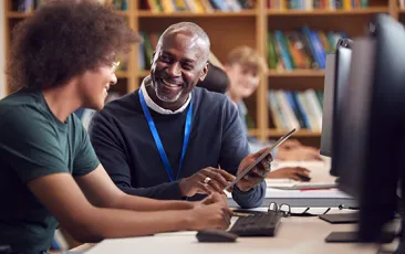 African American mentor and mentee laughing together