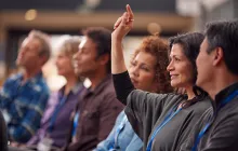 Businesswoman raising hand