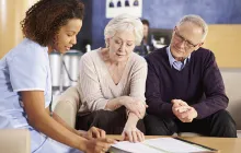 Health practitioner with older couple