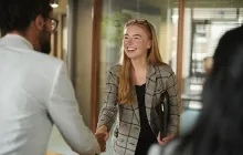 Woman shaking hand with colleague